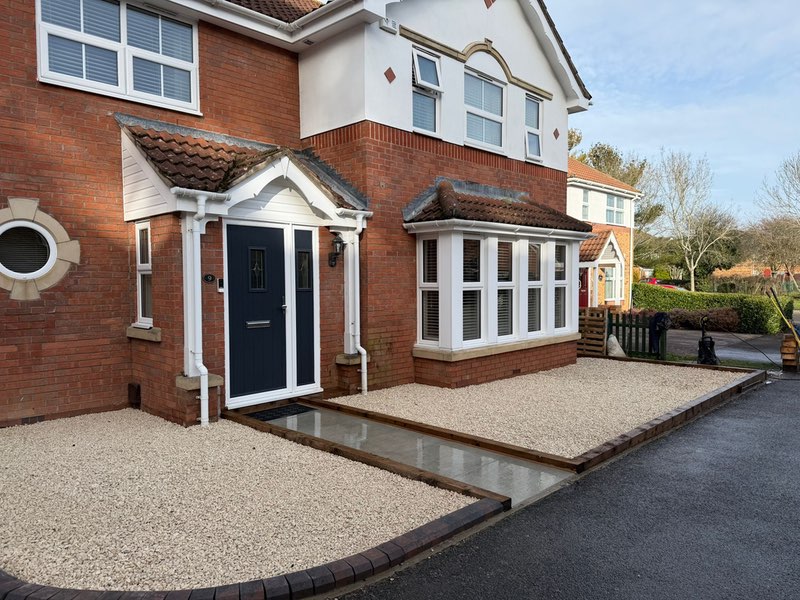 Beautifully presented front garden with light coloured chippings either side of the fornt door