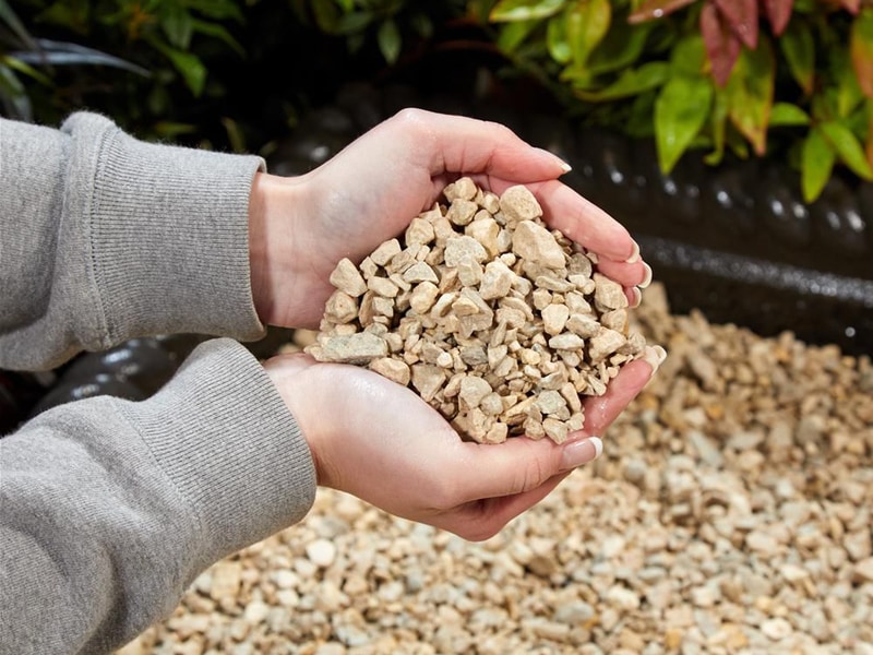A handful of loose chippings checking quality and suitableness