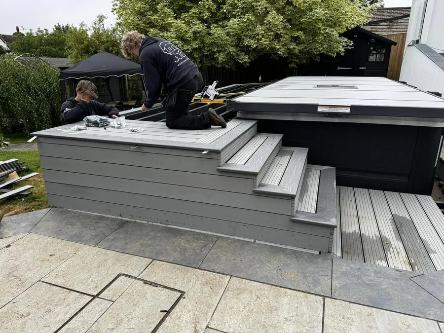 Two of the JJC team fitting the cover on a swim spa